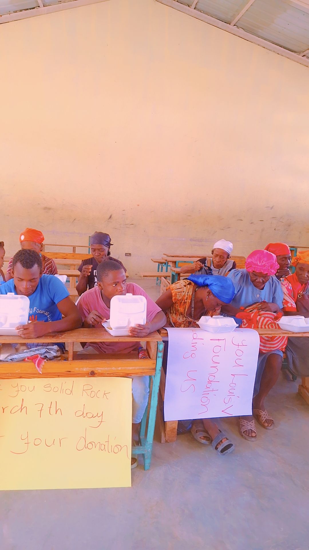 Community members gathered for a meal during outreach